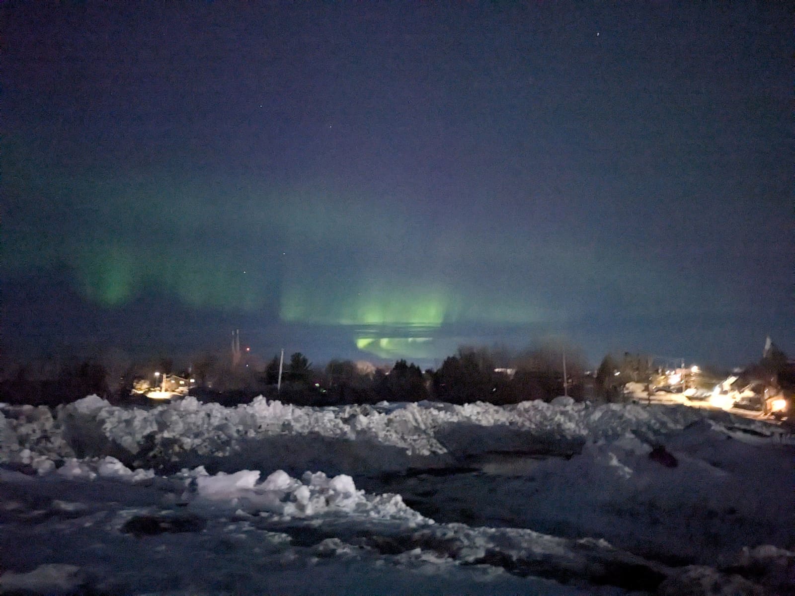Northern lights over the Keweenaw Peninsula winter landscape